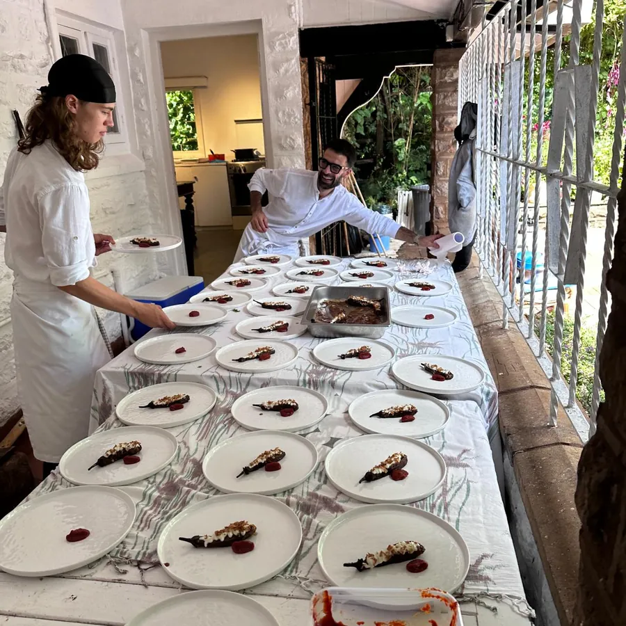 Kenyan private chef Antonio plating a fine-dining course
